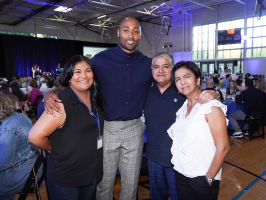 Longtime RA supporter KJ Wright with RA mentor Steph and her family.