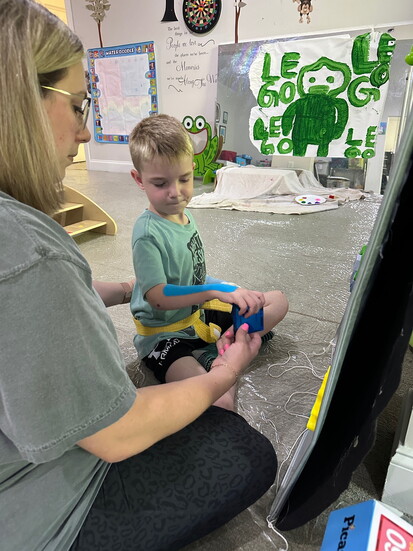 Levi in his therapy lesson at camp 