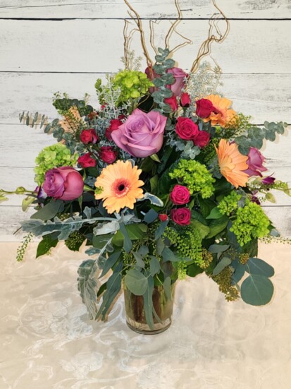 Jeannine Diamond of Wyckoff Florist & Gifts designed this spectacular spring mix containing Mini Green Hydrangea, Roses, Gerbera Daisies, and Dendrobium Orchids