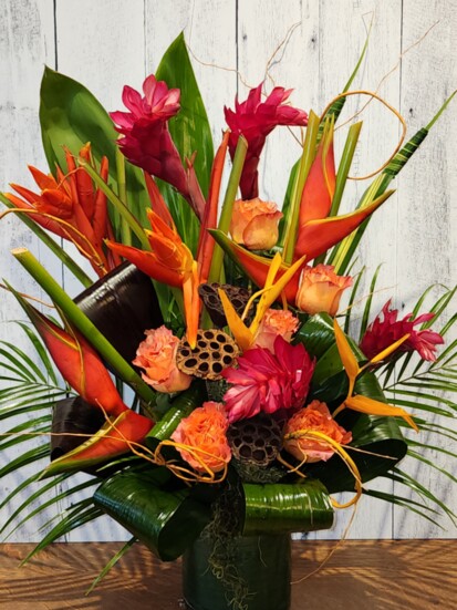 Susan of Creations by Fran Flowers & More designed this amazing tropical arrangement using Birds of Paradise, Ginger, Heliconia, Tropical Leaves and Garden Rose
