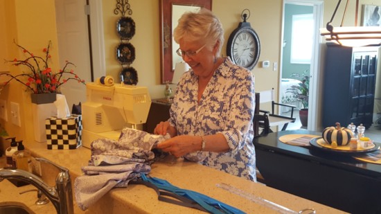 Jacaranda Trace's Paula Glover has been helping make masks.