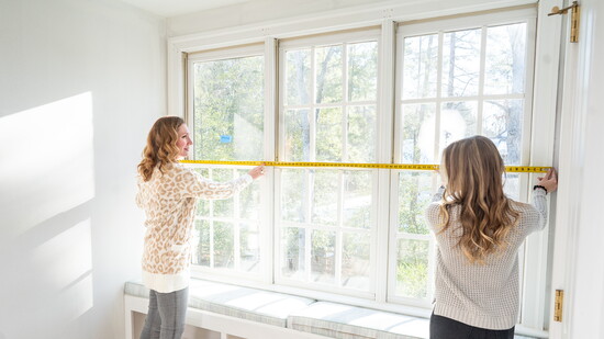 Melissa and Kimberly taking design measurements