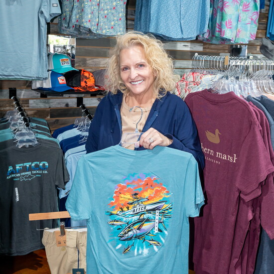 Amy Reed shows off some of the stylish warm weather clothing in stock at Volunteer Outfitters.