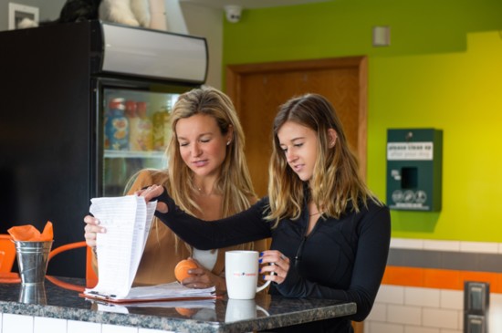 Angela and her daughter, Ellie, organizing their day.