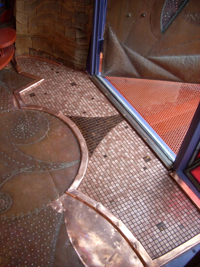 Windows + doorways in Wahopi are embellished with hammered copper remnants.