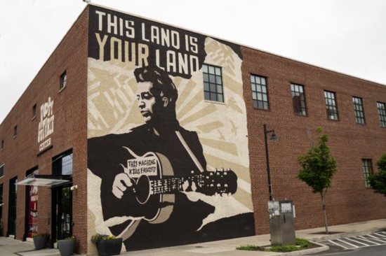Woody Guthrie mural on the side of the Woody Guthrie Center in Tulsa's Arts District.