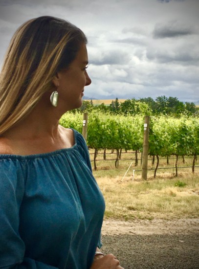 Author Lynette Standley in the summer-ripe vines at Walla Walla Vintners