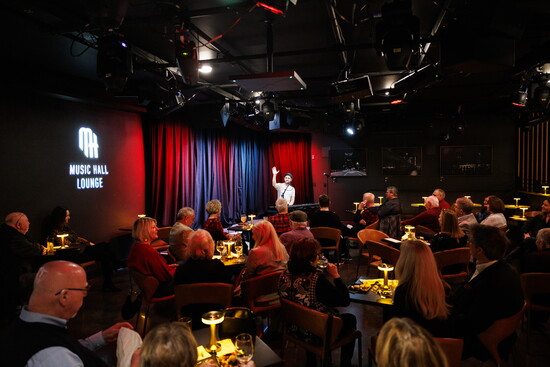 Guests enjoy a show at the Music Hall Lounge