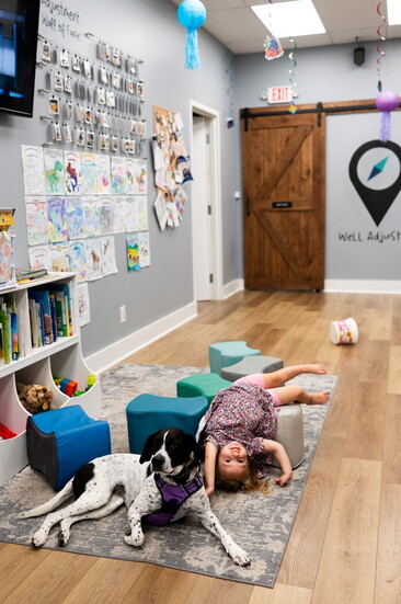 Scout and Lyla Redlinski at play at Crossroads Chiropractic.