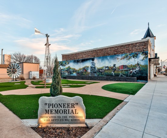 A mural depicts early day Waukomis and the "Pioneer" who settled the area.