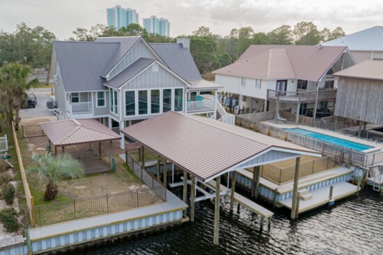 New boathouse, dock, and metal roof by Purdy Restoration 