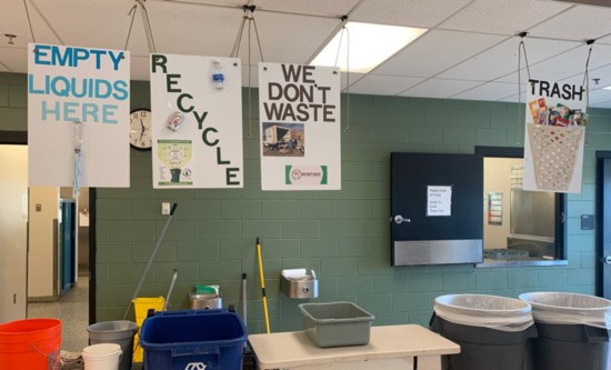 Lone Tree Elementary cafeteria shows signs for students to save We Don't Waste recoverable food.