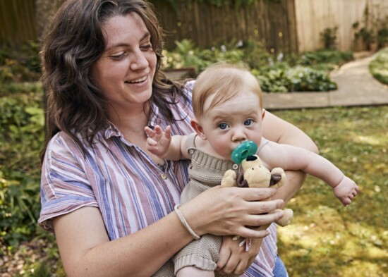 New mom Claire Spollen with her baby Sully in the backyard of photographer Jen Causey