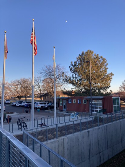 The sun - and the moon - rise over the Y and library.