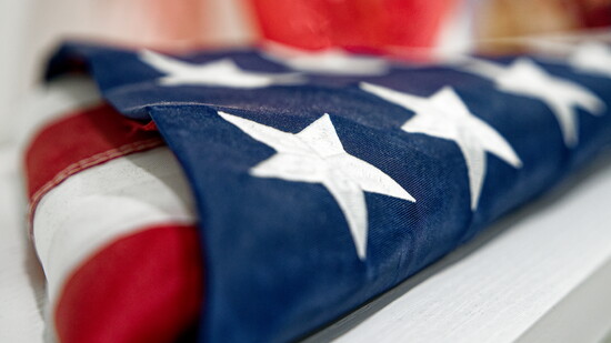 Dan's father played a vital role in helping Dan fall in love with his career. This flag is in his office in memory of him.