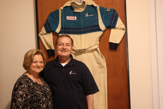 Cookie + Barry Burke with a fireproof race suit worn by Barry during his racing career. 