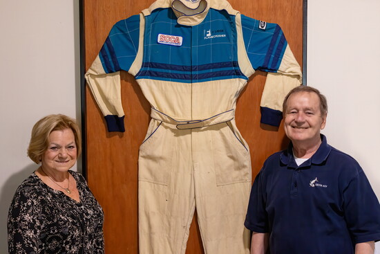Cookie + Barry Burke with a fireproof race suit worn by Barry during his racing career. 