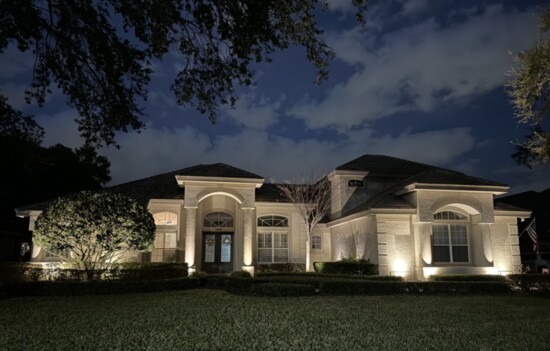 This gorgeous home is highlighted by well-placed outdoor lighting. 