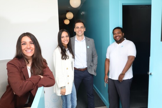 Nicole and Jason Ruscio, center, with the Squeeze team. 