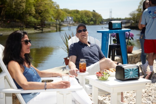 Jennifer and Neal Seidemen enjoying drinks and lunch by the water.