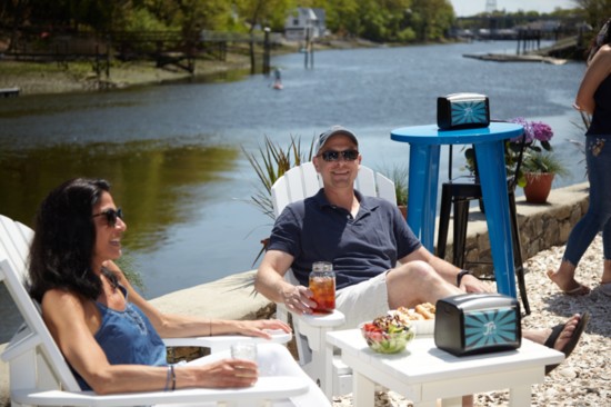 Jennifer and Neal Seidemen enjoying drinks and lunch by the water.