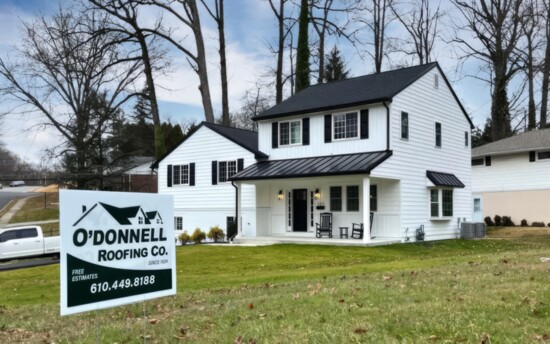 Installed black metal roof accents and white vinyl siding (CertainTeed Certaplank)