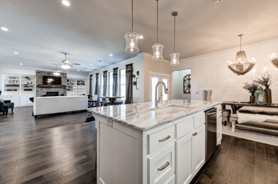 Hard-surface flooring throughout the home and kitchen islands for gathering are among other popular features in today's homes.