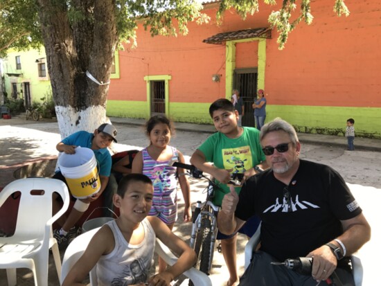 Interacting with the Mexican families that were picking up water filters.