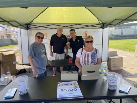 Slinging beers at a community event for a fundraiser.