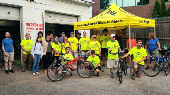 Members of the Seacoast Area Bicycle Riders display bicycles repaired by Seacoast Pedal It Forward volunteers.