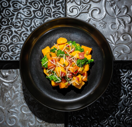 Butternut Squash Gnocchi: house-made gnocchi sautéed with roasted butternut squash, broccoli rabe, pancetta, garlic, olive oil, and pumpkin seeds