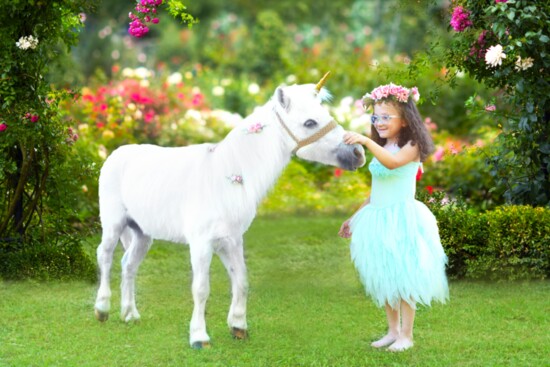 A "unicorn" greets Janie in Bear Creek Park, Houston.