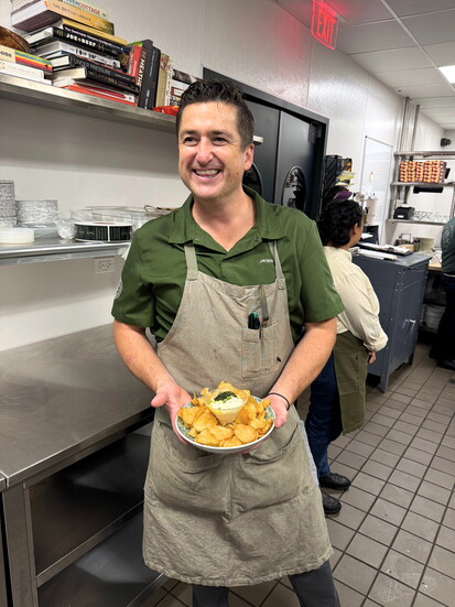 Vice President of Culinary Jaysen Euler shows off a favorite snack: housemade crisps paired with silky, tangy caviar dip.