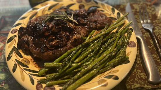 Grilled ribeye steaks with espresso balsamic mushrooms.