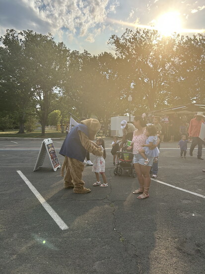 EverFun’s DJ DAWG, the Farm Dawg's mascot, brings fun off the food truck and into the crowd with high fives and smiles for young fans!