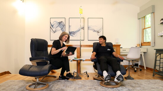 Goodkin consulting with a patient about their treatment plan