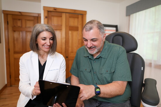 Anna Goodkin goes over results with a client