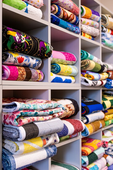 Volunteers craft handmade quilts for each client to take home.