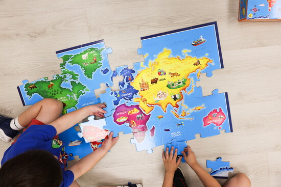 Teamwork in action to complete a puzzle.