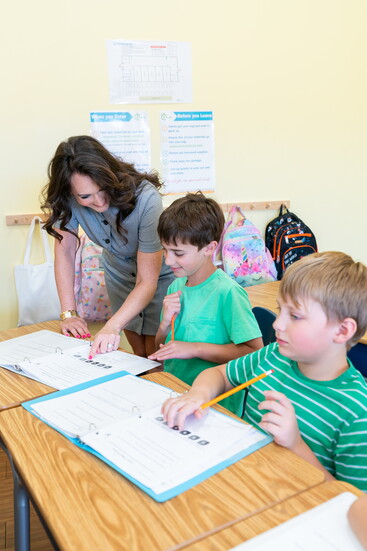 Leah Gallo works with Russian School of Math students. 