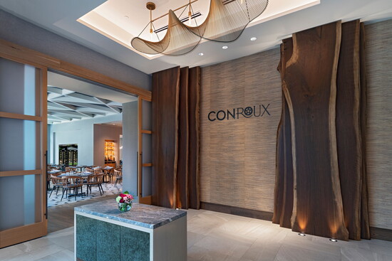 The entrance to Conroux sets the tone for a polished dining experience inside Hyatt Regency Conroe.