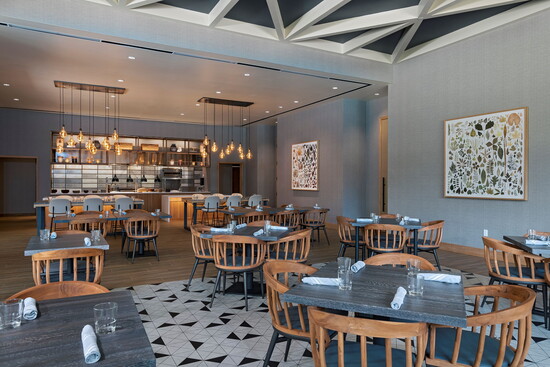 The Conroux dining room blends clean, contemporary design with a warm, relaxed setting made for lingering over a meal.