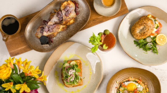 A table at Conroux showcases the restaurant’s range, from fresh Gulf-inspired dishes to hearty Texas favorites.