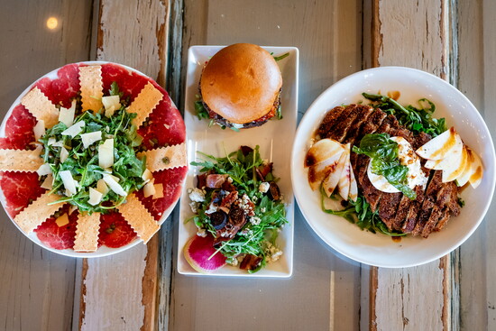 Gather round with shareable bites from The Hearth’s Snack and Appetizer menu, perfect for casual dining with friends in downtown Windsor.