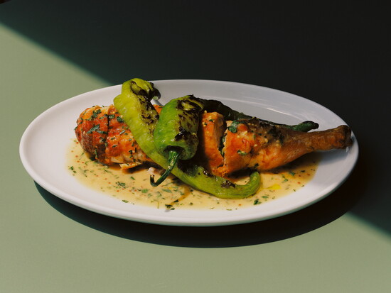 Rada's chicken stuffed with grilled scallion, with sauce moutarde, and grilled long hot peppers. Photo by Laura Pol.