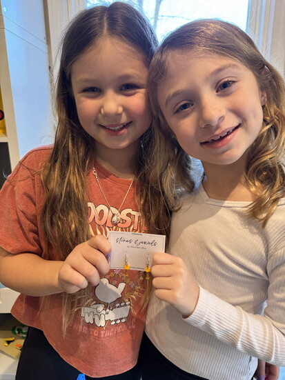 Sara and Josi show their products