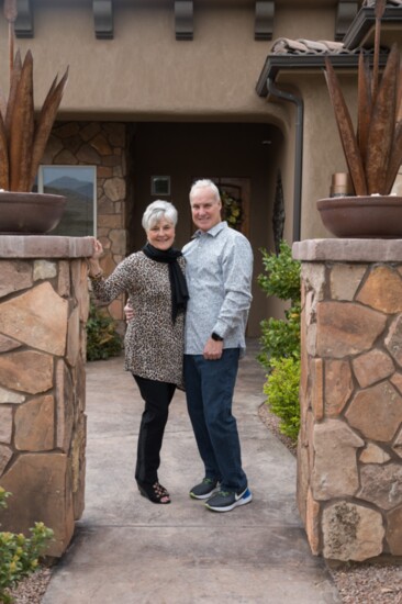 Faith and Paul Havick at the entrance of their home