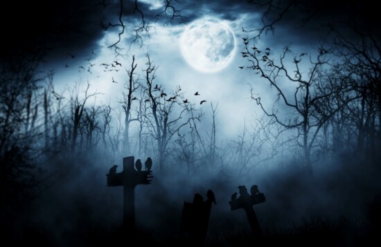 An eerie night with a full moon is haunting. 