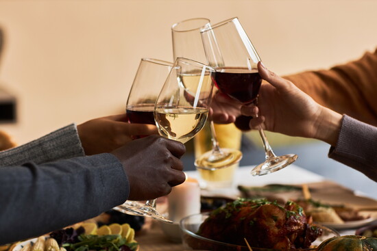 A wine toast over a holiday meal.