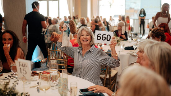 Attendees Participate in Silent & Live Auctions... 